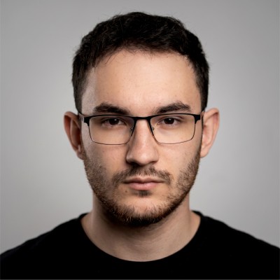 Portrait of the founder in a dark desaturated treatment
